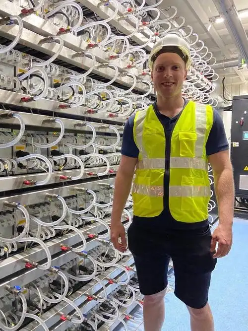 Expansive cryptocurrency mining farm with rows of high-performance miners